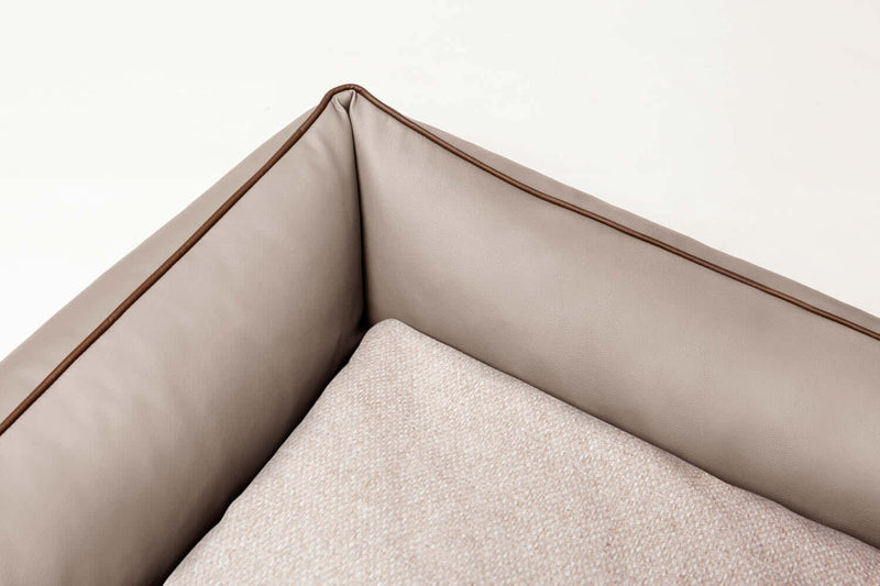 Detailed image of Bolster dog bed showing luxury fabrics