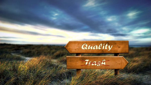 road sig showing the way to quality