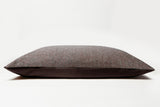 Brown textured pillow on a white background
