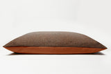 Brown textured pillow on a white background
