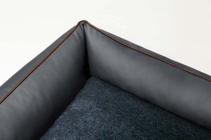 Detailed image of Bolster dog bed with grey leather and woven fabric 