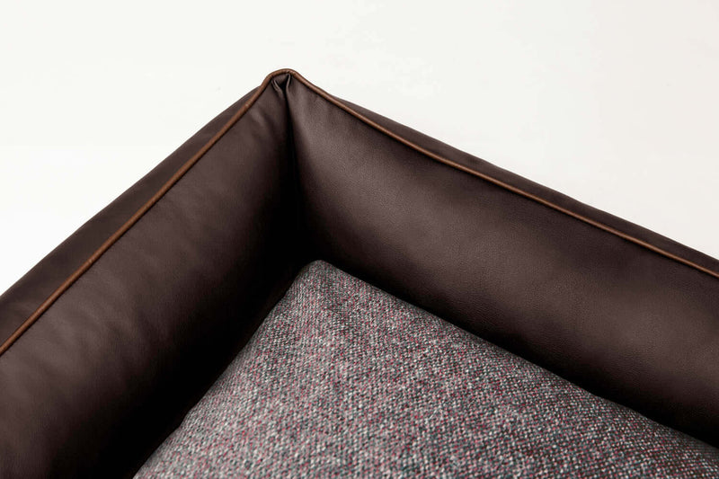 Detailed image of Bolster dog bed showing luxury fabrics